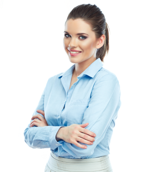 A person with long brown hair smiles while crossing their arms, embodying the confidence of a seasoned professional. Dressed in a light blue shirt, they stand against a backdrop patterned with small triangles in shades of green and beige, bringing to mind the vibrant real estate scene in Indianapolis.